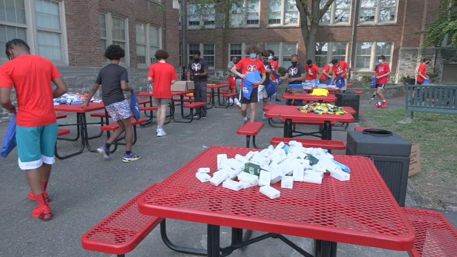 DuPont Manual boys basketball team stuffs backpacks (2).jpeg