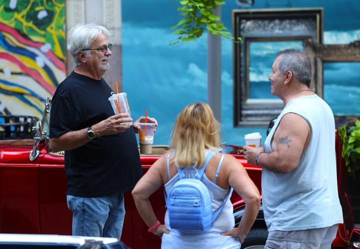 Three people talk about Street Rods.JPG