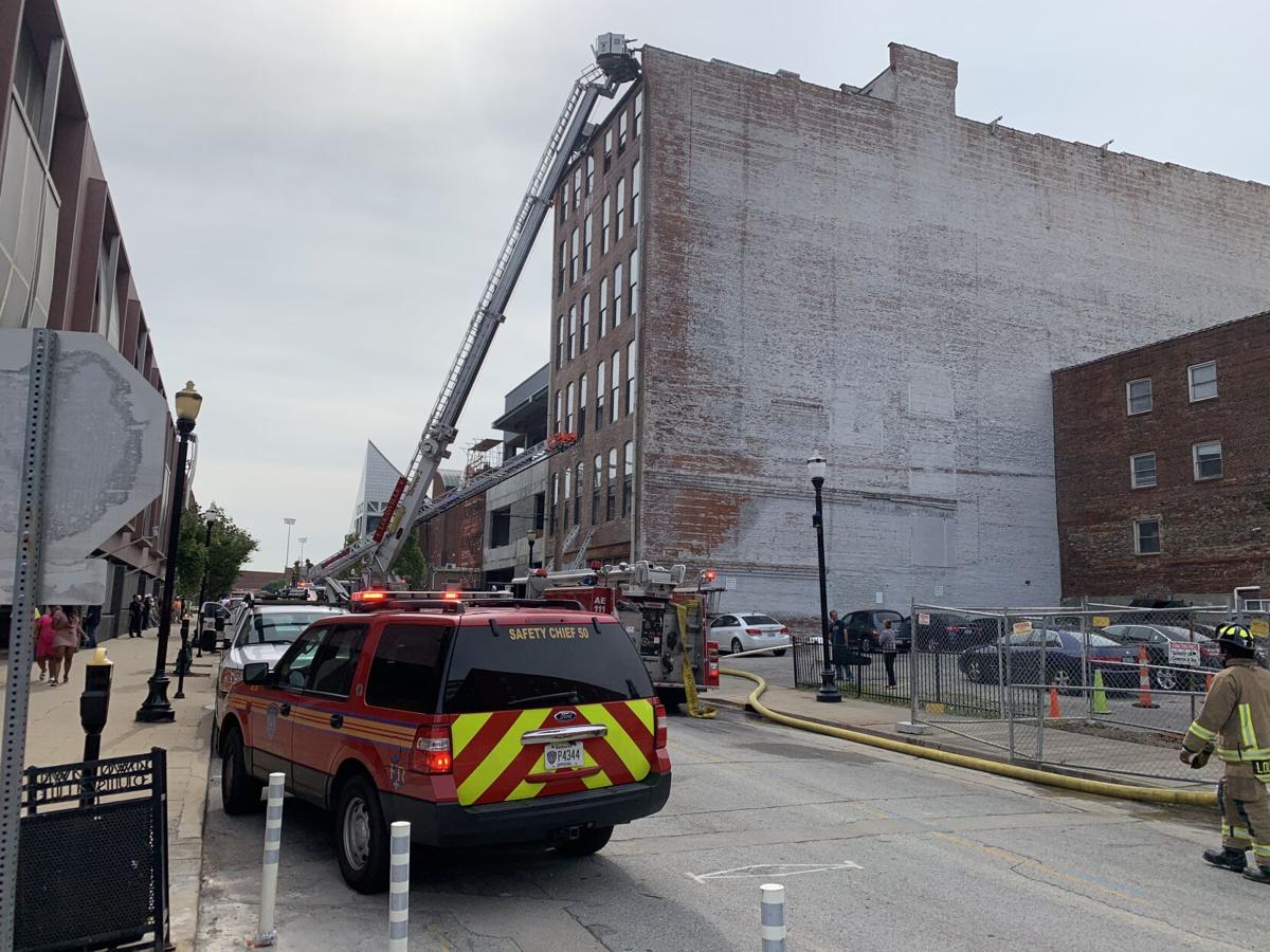Fire crews battle fire atop downtown Louisville building News