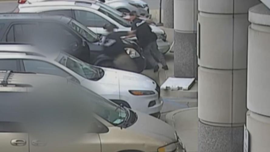 Bryan Carroll apprehended by UK Police outside UK Hospital on Thursday, March 25, 2021