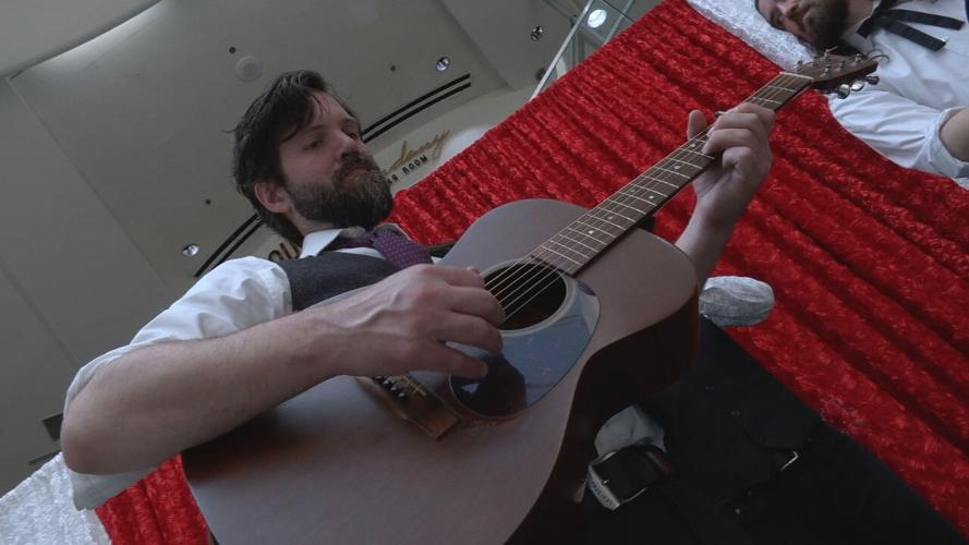 A Bluegrass band plays at Louisville Muhammad Ali International Airport ahead of Derby weekend