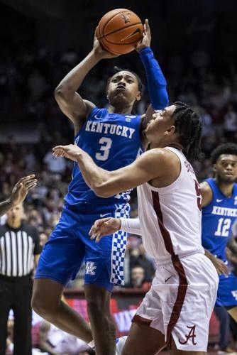 Kentucky guard TyTy Washington Jr. shoots over Alabama guard Jaden Shackelford.jpeg