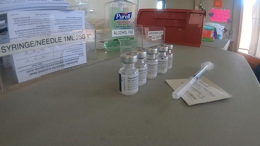 A COVID-19 vaccine at Baptist Health Floyd's drive-thru clinic