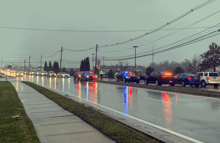 Police cars pulling into Deidre Mengedoht funeral