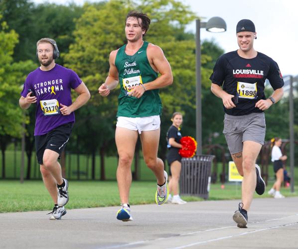 Three men compete in the Race to Cure Sarcoma.JPG