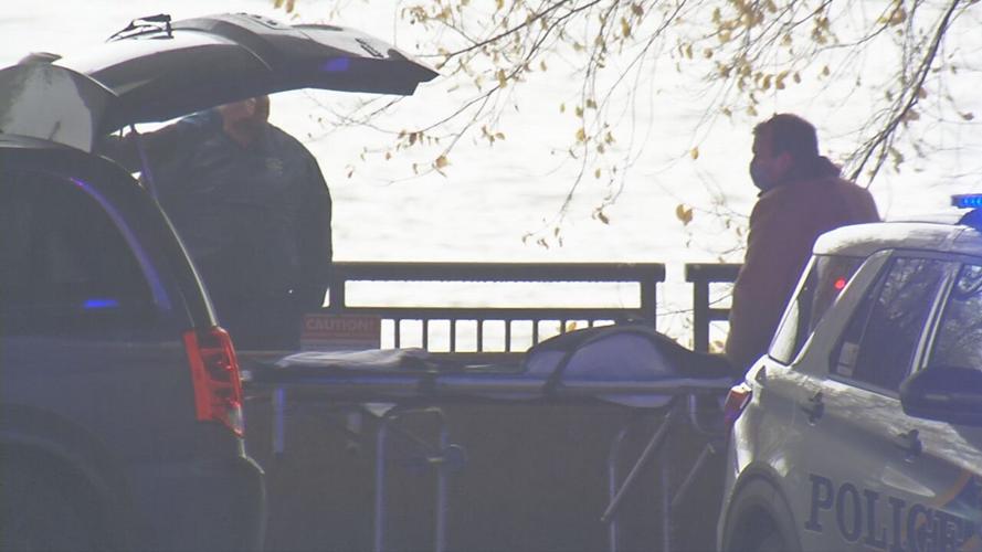 Police cars and gurney at downtown Louisville homicide scene (generic)