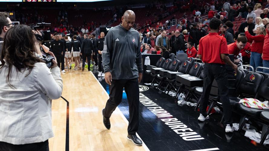 Kenny Payne leaves the court