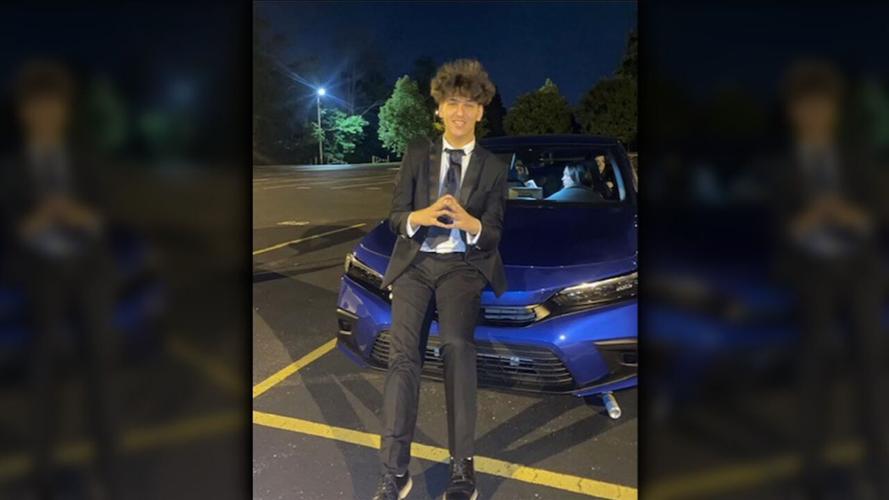 Mohammad Hussein stands near car