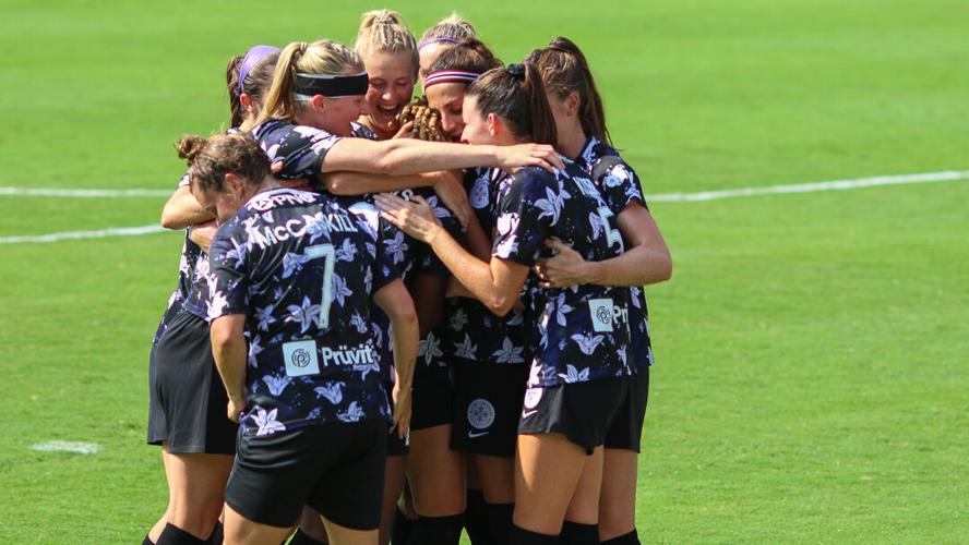 Racing Louisville huddle