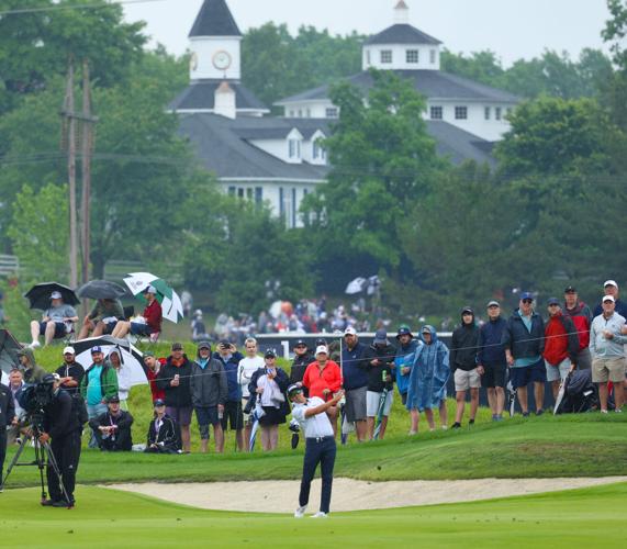 Rickie Fowler hits with Valhalla clubhouse in background.JPG