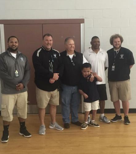 Jacob Hill with coaches.jpeg