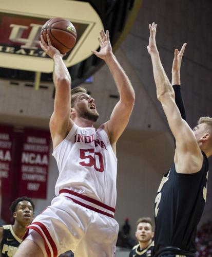 Indiana forward Joey Brunk (50) takes a shot as Purdue center Matt Haarms defends