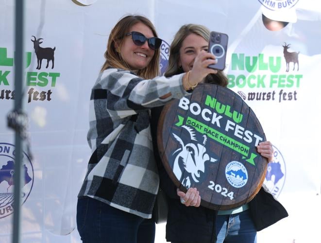 2 women take selfies at Bock Fest.JPG