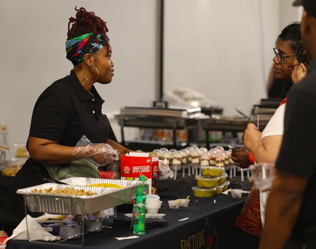 Vendors share food at Taste of West Louisville.JPG