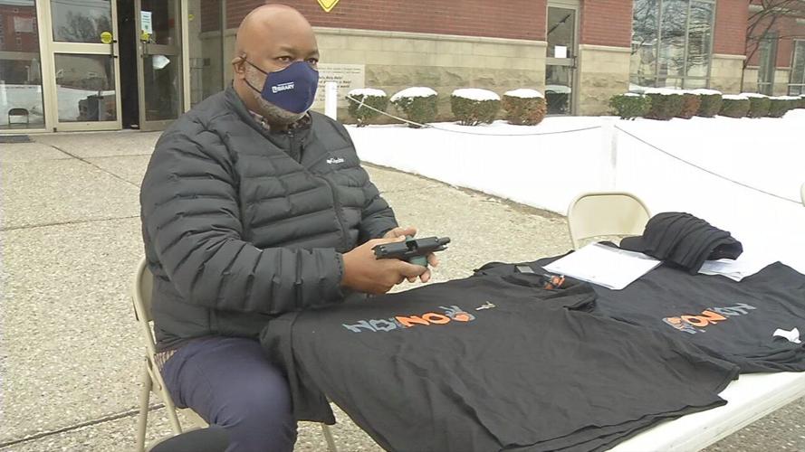 A retired deputy, demonstrates how to install a gun lock