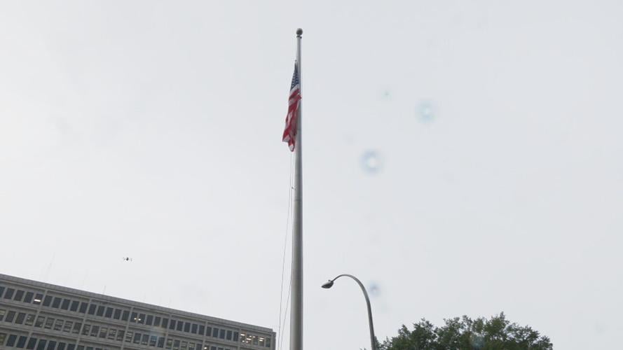 US flag raised over LMPD headquarters in downtown Louisville