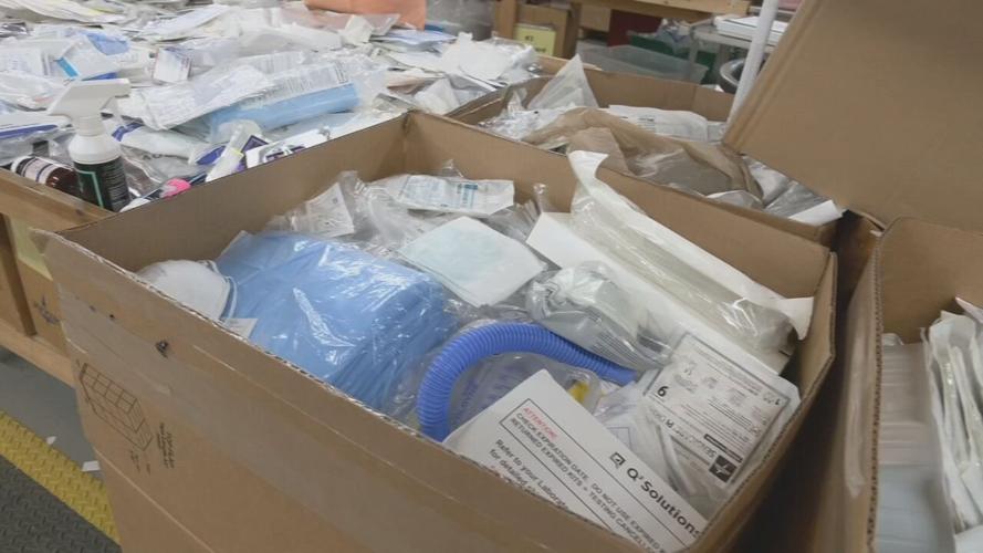 Volunteers for Louisville-based SOS pack medical supplies for JCPS students