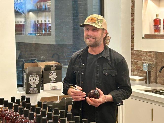 Dierks Bentley signs bottles.jpg