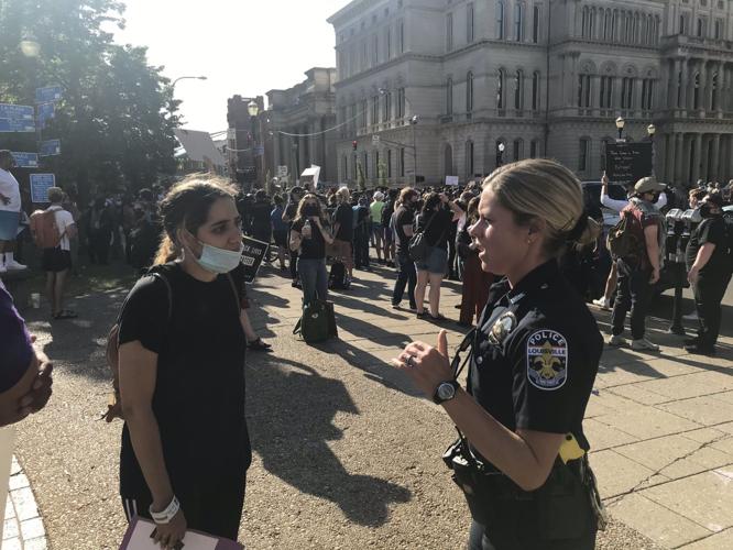 Officers talk with protesters (2) 6-1-20