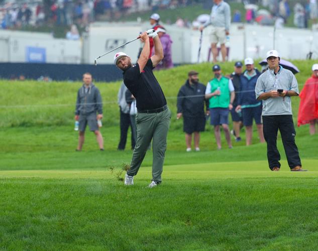 Jon Rahm hits a fairway shot.JPG