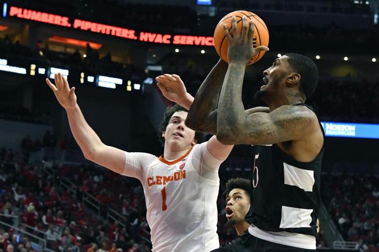 Louisville forward Malik Williams shoots past Clemson forward Ian Schieffelin.jpeg