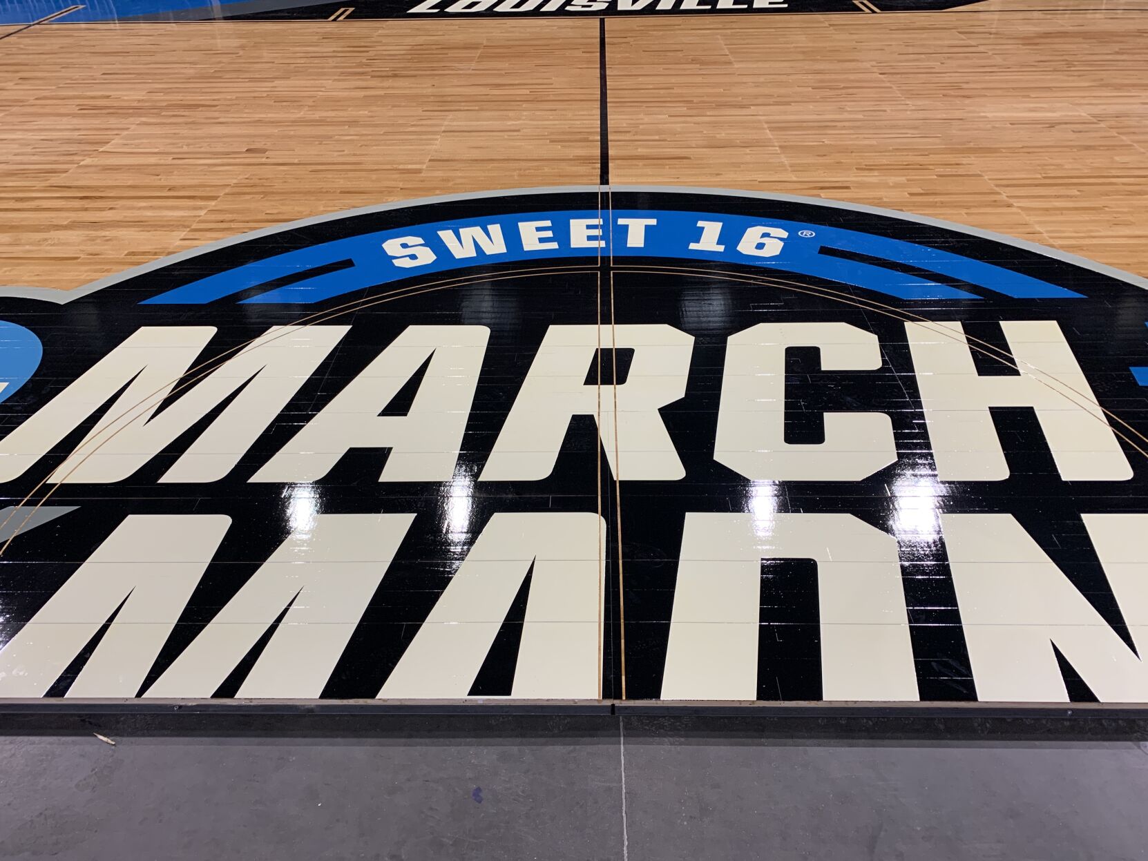 NCAA FLOOR  BEING INSTALLED AT YUM CENTER 3-21-2023 (14).JPG