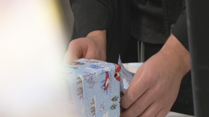 Ashton Gillotte wraps gifts at The Lord's Kitchen 12-18-24