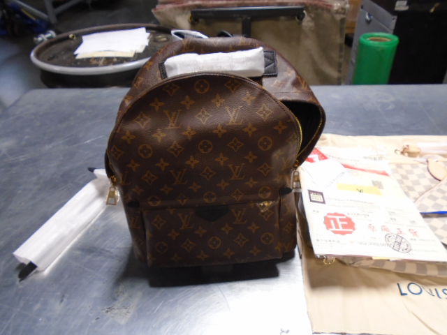 FILE--Fake Louis Vuitton handbags are confiscated at a warehouse