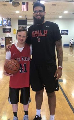 Trey Moses poses with a young fan