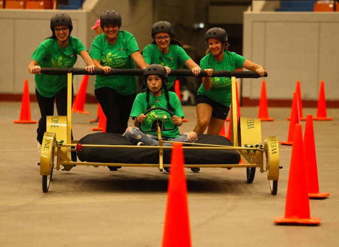 Group pushes bed at races.JPG