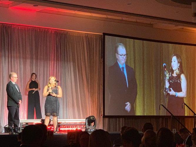 Valarie Chinn and Doug Smith accept Emmy
