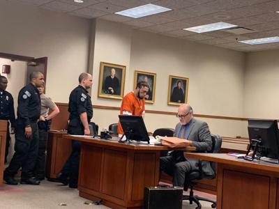 Brice Rhodes enters the courtroom