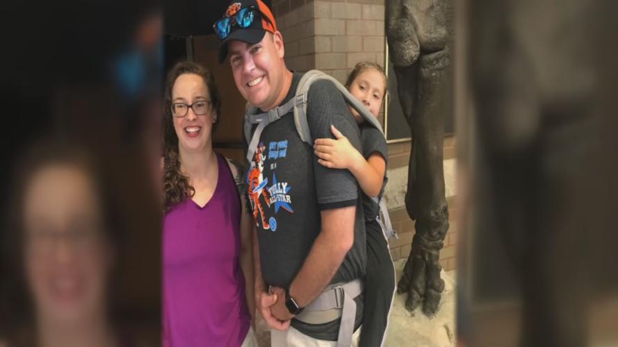 Tully Elementary teacher Jim Freeman carries 10-year-old Ryan Neighbors on his back for a school field trip