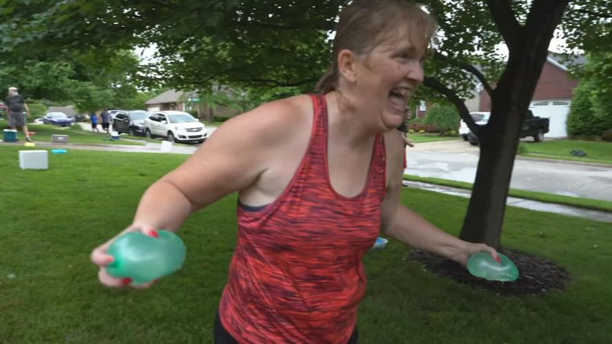 Lori Mattingly pelting students with water balloons on the last day of school in Sellersburg
