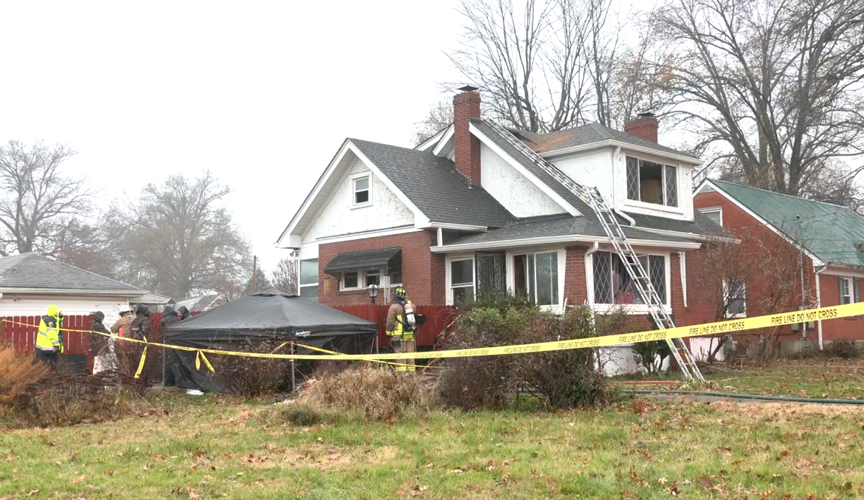Louisville investiagtors at scene of fire where body found in burning home in Beechmont