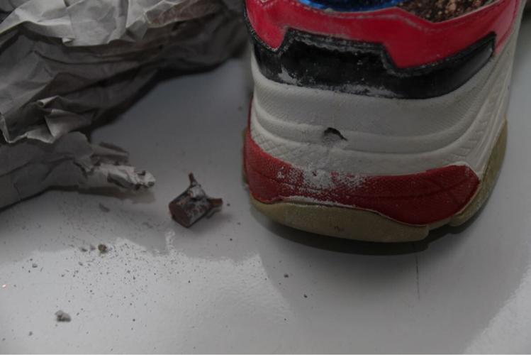 A bullet hole in a shoe inside Breonna Taylor's apartment