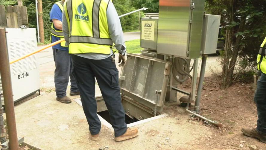 MSD workers near sewer well where MSD worker fell