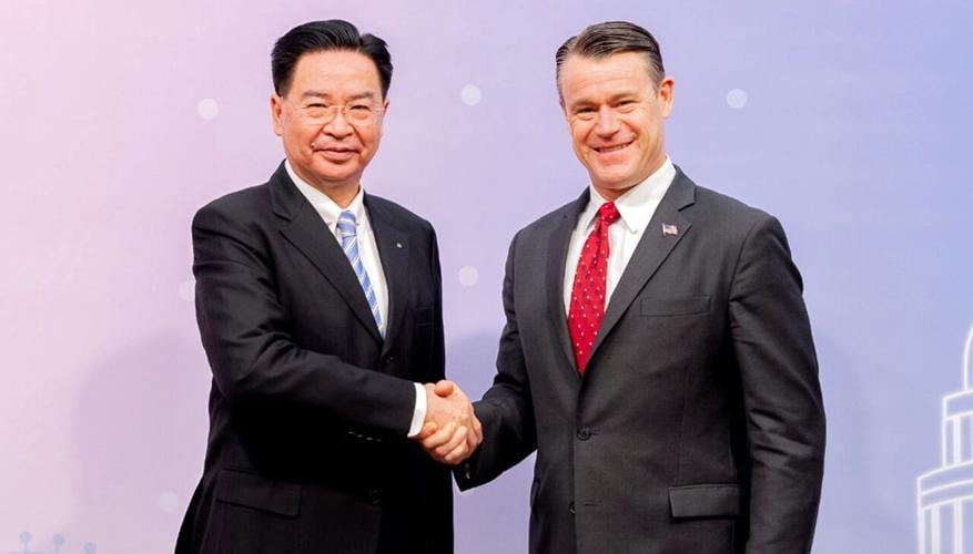 Joseph Wu, minister of foreign affairs for Taiwan, shakes hands with US Indiana Sen. Todd Young