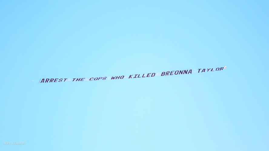 "Arrest the cops who killed Breonna Taylor" banner over Churchill Downs before Derby 146