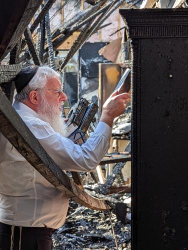 Rabbi Avrohom Litvin goes through fire damage