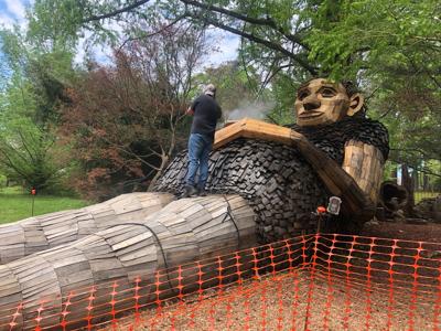 Mama Loumari cleaning in Bernheim Forest.jpg