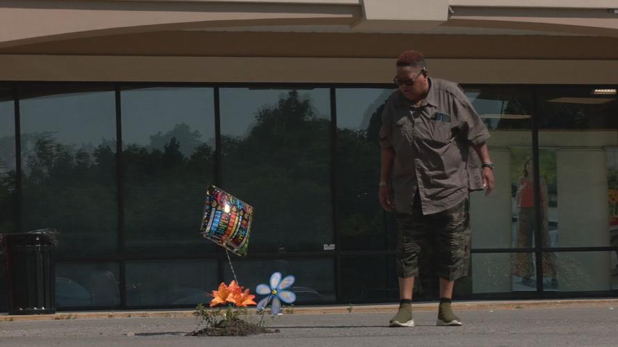 Fake flowers planted in pothole outside primary care office on Dixie Highway