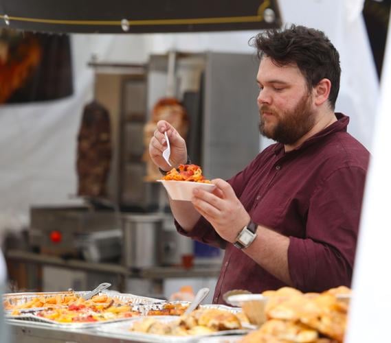 Vendor scoops out pasta at Harvest Homecoming.JPG