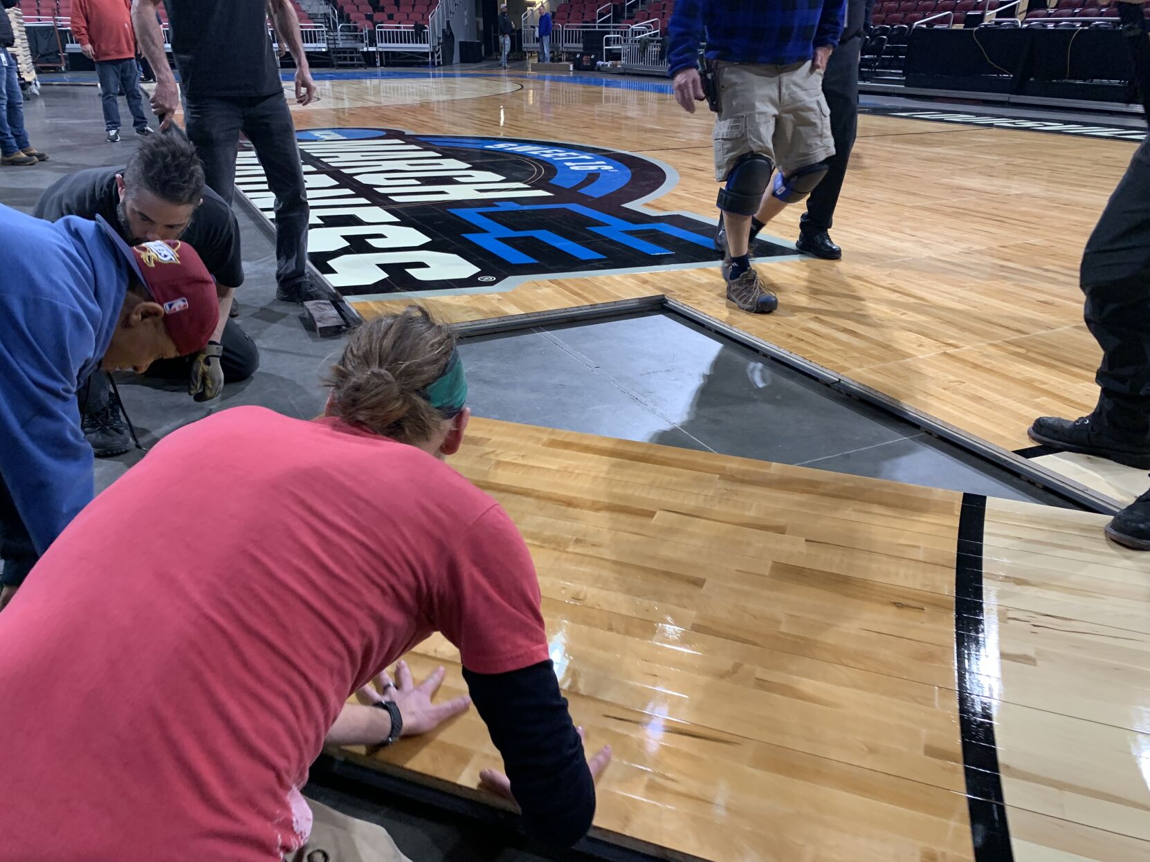 NCAA FLOOR  BEING INSTALLED AT YUM CENTER 3-21-2023 (13).JPG