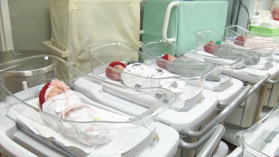 Babies in red hats for American Heart Month