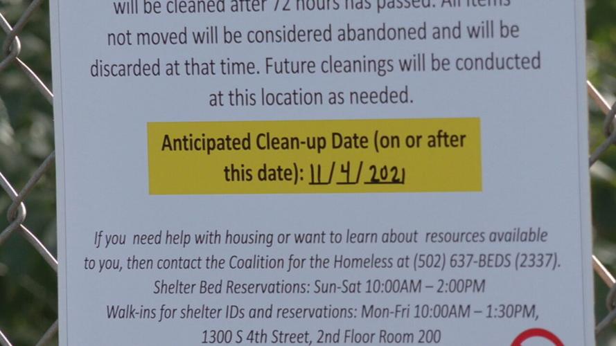 Notice posted at homeless encampment in downtown Louisville