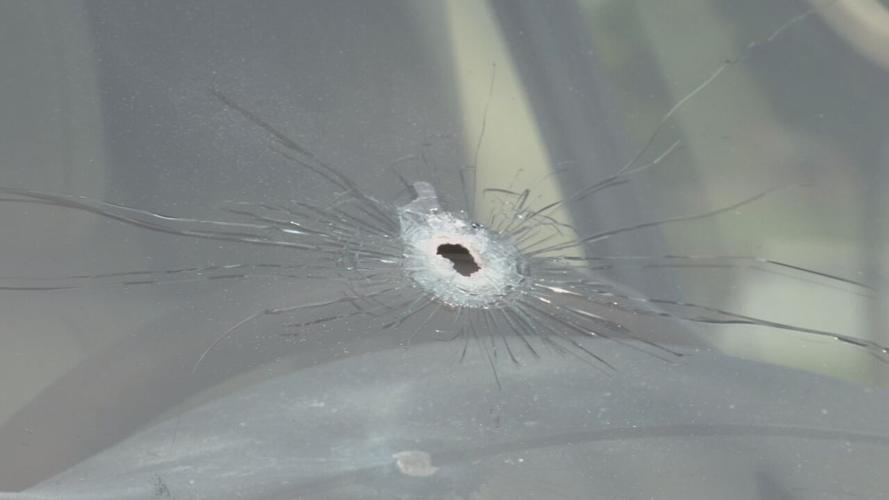 Bullet hole windshield vehicle at Norton Commons.jpeg