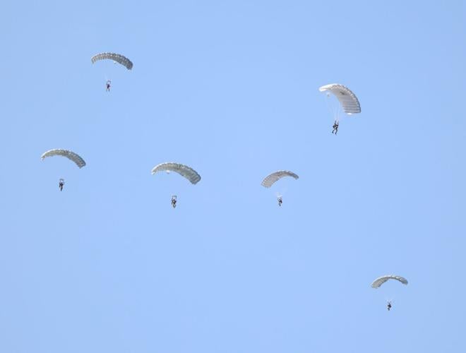 Parachute team lands near Ohio River.JPG