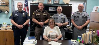 Adair County Judge Executive Gale Cowan and area law enforcement heads