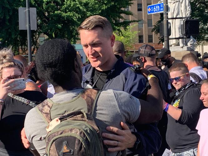 LMPD officer hugs protester-6-1-20 (2).JPG